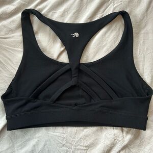 Solid black sports bra with cute detailed back